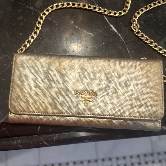 Prada Handbags - Prada wallet in gold leather with chain